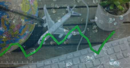 Green graph moving over bitcoins symbols against globe, plane model and keyboard