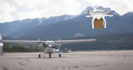 Wall murals Airport Drone carrying a box in an airport