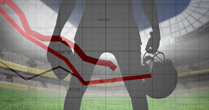 Image of graphs and data processing over midsection of american football player at stadium