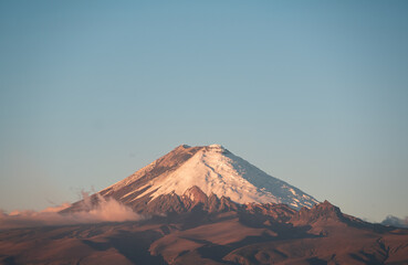 Cotopaxi volcano at sunset with blue sky background, Andes mountains, Ecuador
