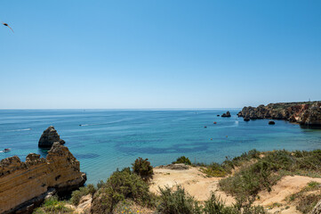 Panorama of the tourist Praia de Dona Ana de Lagos in the Algarve, Portugal in the summer of 2022