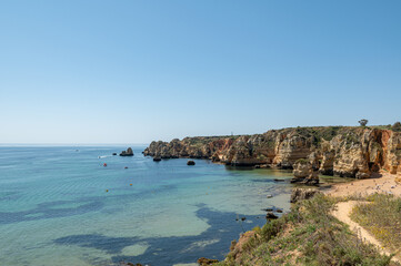 Panorama of the tourist Praia de Dona Ana de Lagos in the Algarve, Portugal in the summer of 2022