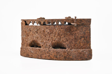 Vintage rusty cast iron isolated on white background.