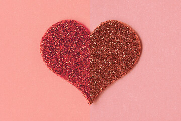 One glittering red heart on a paper background