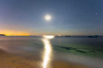 full moon shining above quiet sea bay, night summer sea vacation scene