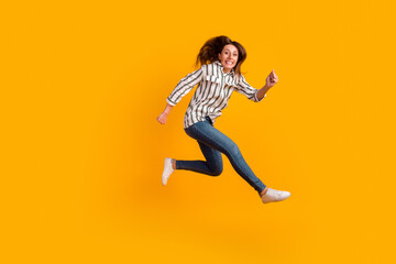 Fototapeta na wymiar Full body profile side photo of young excited woman jump up active isolated over yellow color background