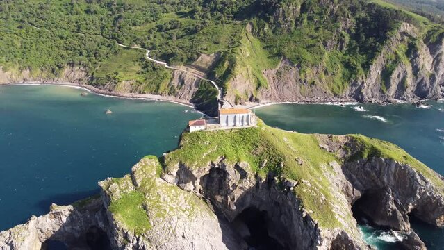Aerial footage of San Juan de Gaztelugatxe temple in the basque coast, spain