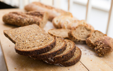 fresh loaf of bread on wooden board