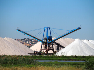 Sea salt mining, salt mountains and transporter