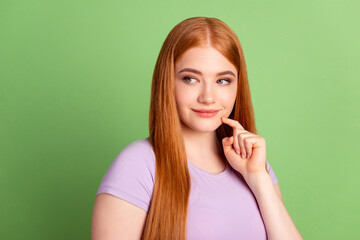 Profile side photo of young woman finger touch chin wondered look empty space isolated over green color background
