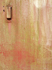texture of an old metal garage door or fence with traces of rust