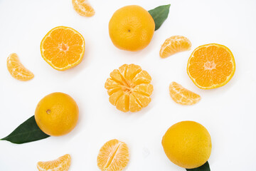 Tangerine or kamala over on white background, top view