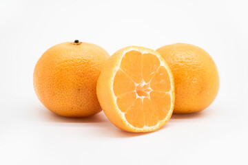 whole and slice Tangerine or kamala over on white background,