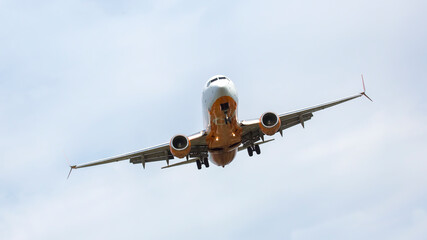 Passenger jet plane flies in the sky. Air transport industry