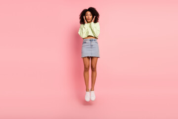 Full length photo of young adorable girl jumper excited news information discount isolated over pink color background