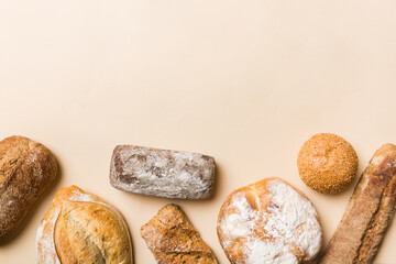 Homemade natural breads. Different kinds of fresh bread as background, top view with copy space