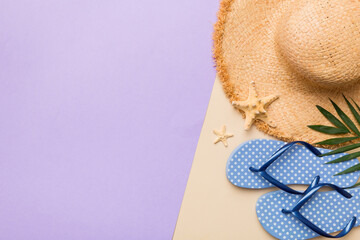Summer vacation concept flat lay. straw hat beach accessories and flip flop top view. Space for...