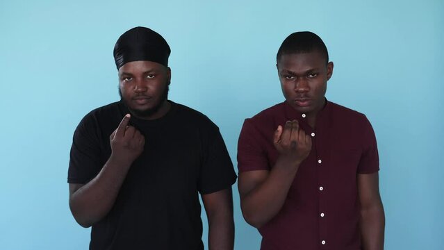 Inviting gesture. Come here. Fight threat. Boomerang motion. Serious strict unfriendly African men gang with angry expression isolated on blue background GIF loop animation.