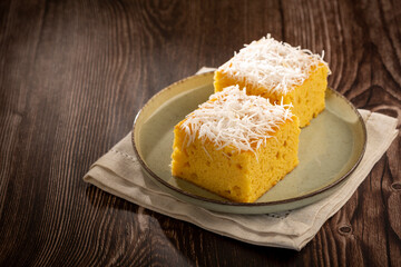 Sliced ​​coconut cake on the table.
