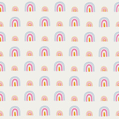 Cute seamless pattern with colorful rainbows on white background