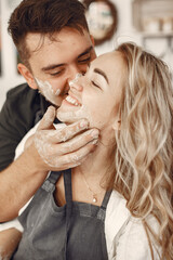 Young couple at artwork in pottery