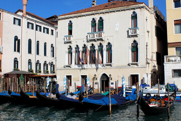 Venice canal view. Colorful facades, boats, calm river water. Beautiful architecture of Italy. Most romantic travel destinations. 