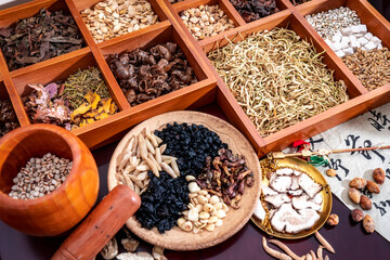 Chinese herbal medicine and flower tea on wooden