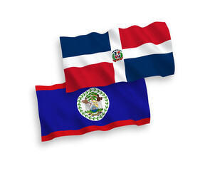 Fototapeta premium National vector fabric wave flags of Dominican Republic and Belize isolated on white background. 1 to 2 proportion.