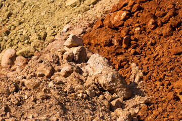 Accumulation of very dry earth with earthy colors, predominantly ocher and pink.