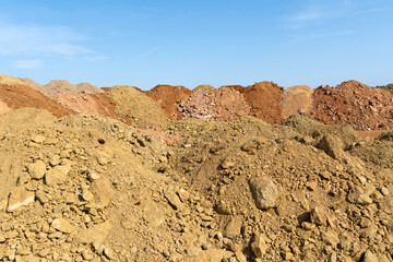 Accumulation of very dry earth with earthy colors, predominantly ocher and pink.