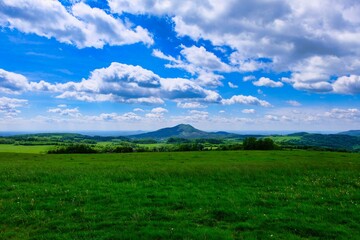 panorama of the beautiful landscape of the Czech Republic. sunny afternoon. Wonderful spring landscape. grass field and hills. rural scenery
