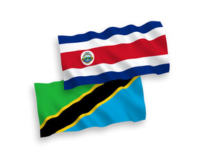 National vector fabric wave flags of Republic of Costa Rica and Tanzania isolated on white background. 1 to 2 proportion.
