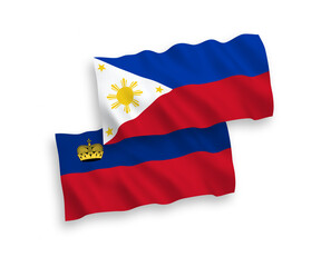 National vector fabric wave flags of Liechtenstein and Philippines isolated on white background. 1 to 2 proportion.