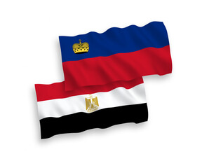 National vector fabric wave flags of Liechtenstein and Egypt isolated on white background. 1 to 2 proportion.