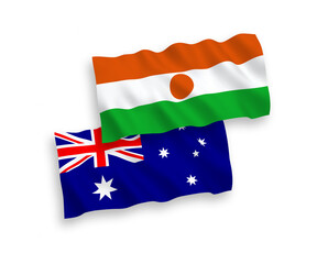 National vector fabric wave flags of Australia and Republic of the Niger isolated on white background. 1 to 2 proportion.