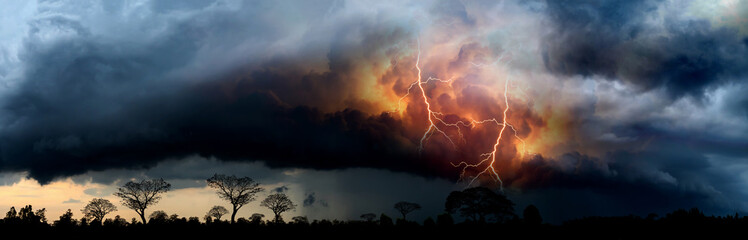 Panorama Dark cloud at  night with colorful spark  thunder bolt. Heavy storm bringing thunder,...