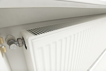 Closeup view of modern radiator. Central heating system