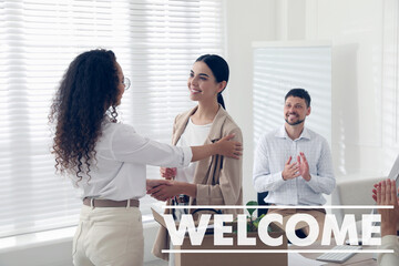 Welcome to team. Employee shaking hands with intern in office