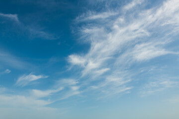 Blue sky with white clouds at sunny day. Abstract sky nature background. Beautiful summer cloudscape