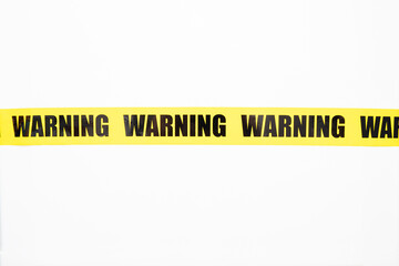 Yellow warning tape isolated and cutout on white background. Risk and accident concept