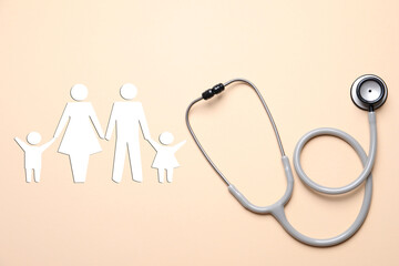 Health insurance. Stethoscope and illustration of family on beige background, top view