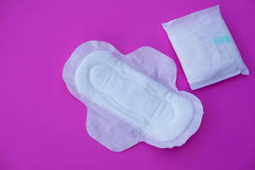 White sanitary pad 
on pink background. Concept: female's hygienic product for period's day....
