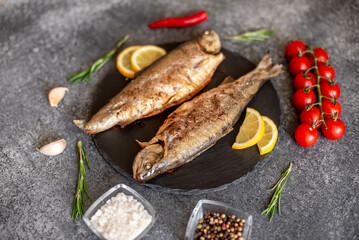 grilled trout on a stone background