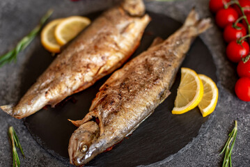 grilled trout on a stone background