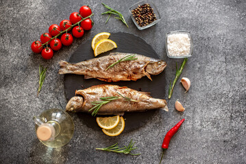 grilled trout on a stone background