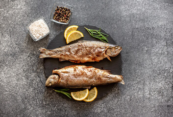 grilled trout on a stone background