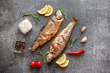 grilled trout on a stone background