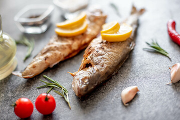 grilled trout on a stone background