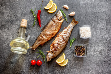 grilled trout on a stone background