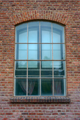 old window of a red brick building